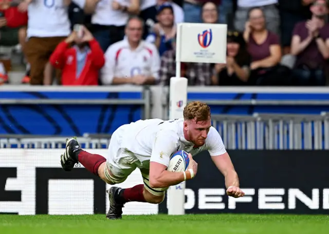 Ollie Chessum of England dives over the line to score a try