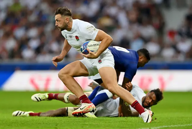 Jonny May of England runs with the ball