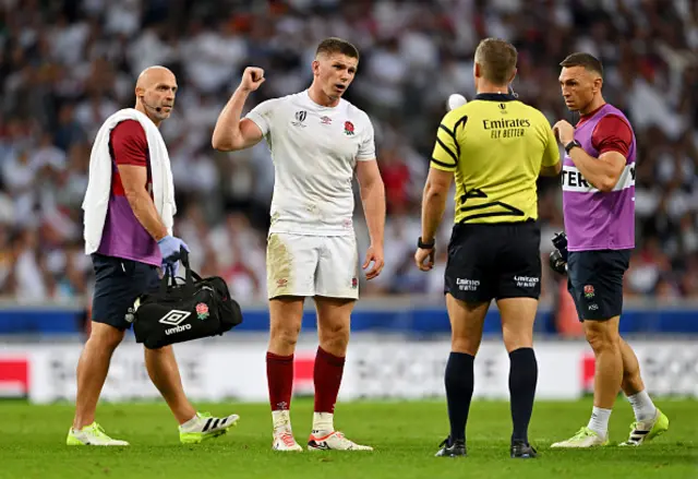 Owen Farrell of England speaks with Referee Andrew Brace