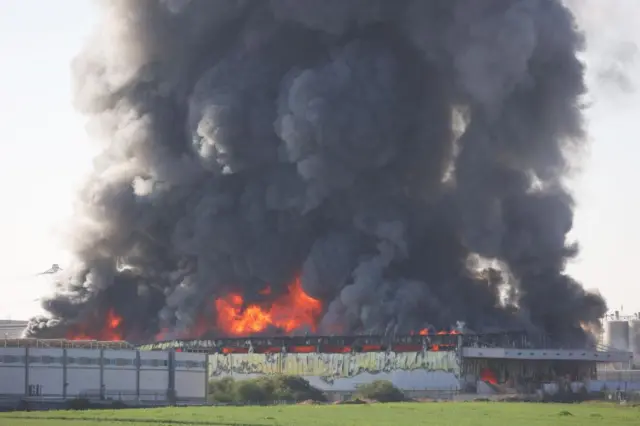 A blazing structure after a direct hit on the Israeli city of Gedera