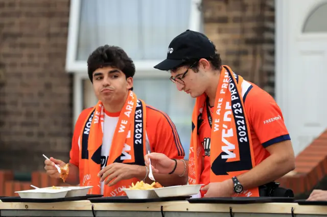 Luton fans each pre-match chips outside the ground.