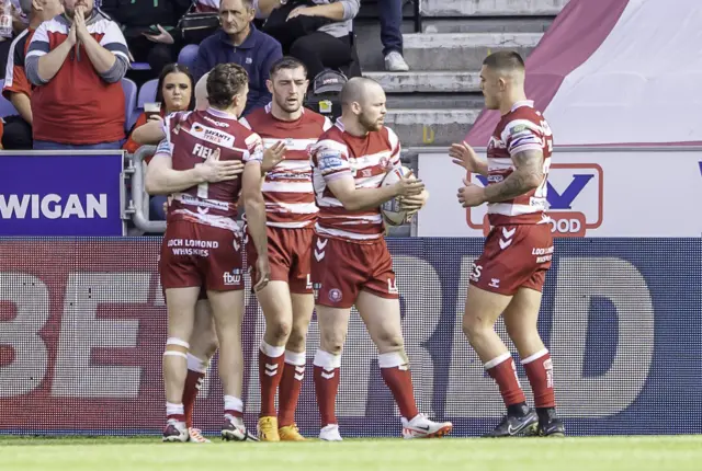 Wigan celebrate another try v Hull KR