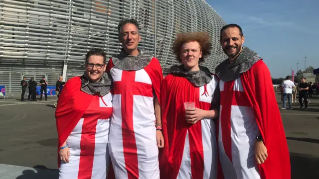 England fans pose outside the Stade Pierre Mauroy in Lille