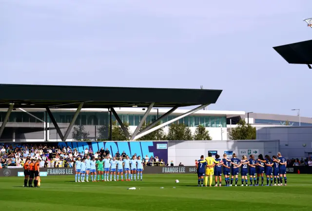 Players observe a moment's silence for City legend Franny Lee ahead of kick off.