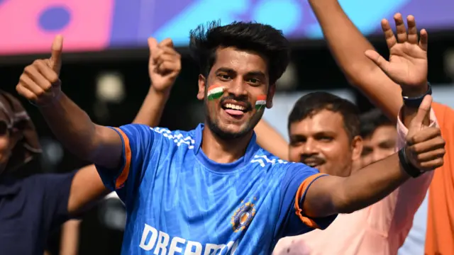 An India fan in the crowd at a cricket match