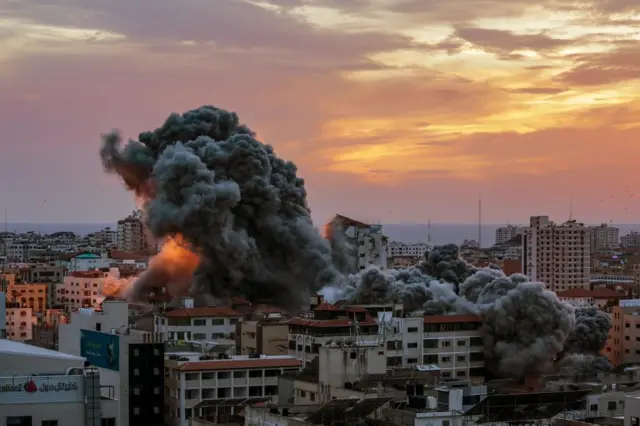 Smoke rises after Israeli warplanes targeted the Palestine tower in Gaza