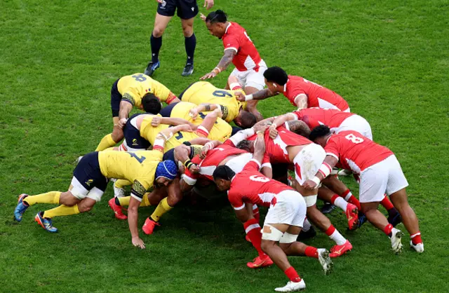 The two teams contest a scrum