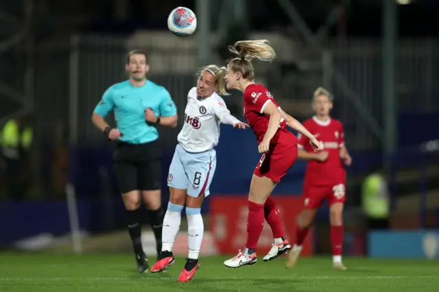 Nobbs is beaten in an aerial duel by Hobinger.