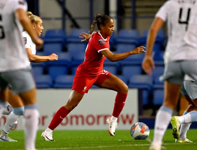 Hinds dribbles away from the Villa defence.