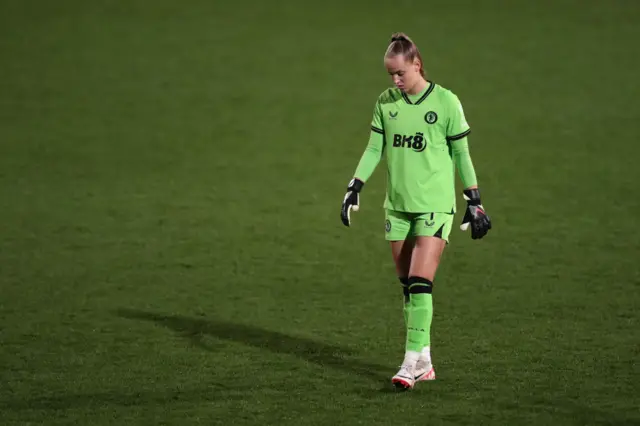 Van Domselaar stares at the floor as she patrols her box.