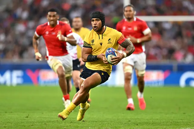 Taliauli Sikuea of Romania runs with the ball