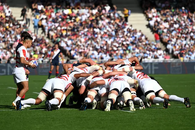 The two teams contest a scrum