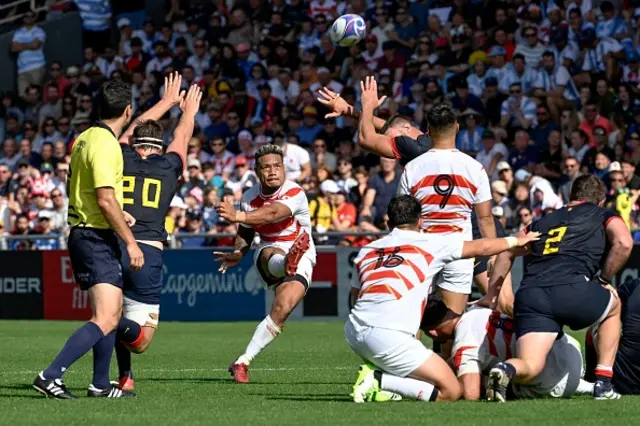 Japan's full-back Lomano Lemeki kicks a drop goal