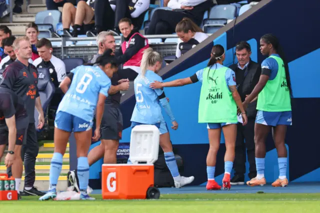 Greenwood makes her way down the tunnel after being sent off.