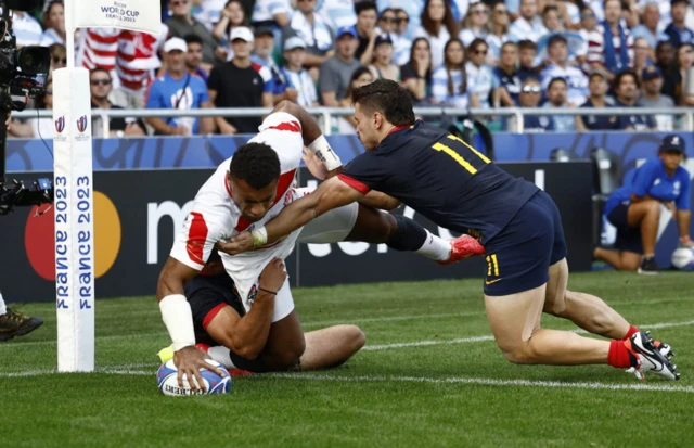 Jone Naikabula dives in the corner to score a try against Argentina