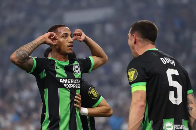 Joao Pedro (left) celebrates scoring in Marseille