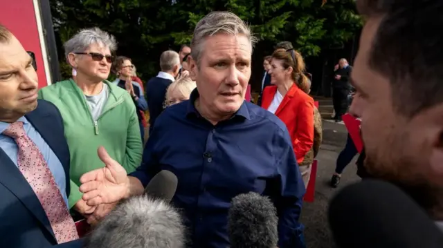 Keir Starmer speaking with reporters