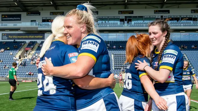 Leeds Rhinos' Jenna Greening and Amy Hardcastle embrace after booking their Grand Final spot