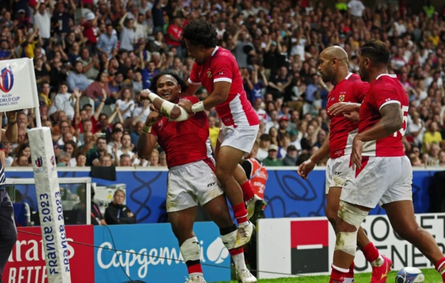 Solomone Kata celebrates with teammates