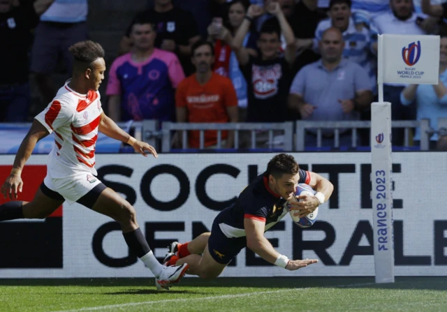 Mateo Carreras dives over the line to score