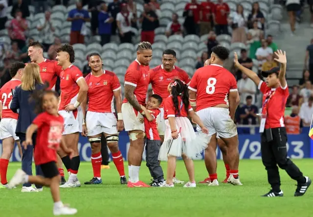 Tonga teammates together after the game