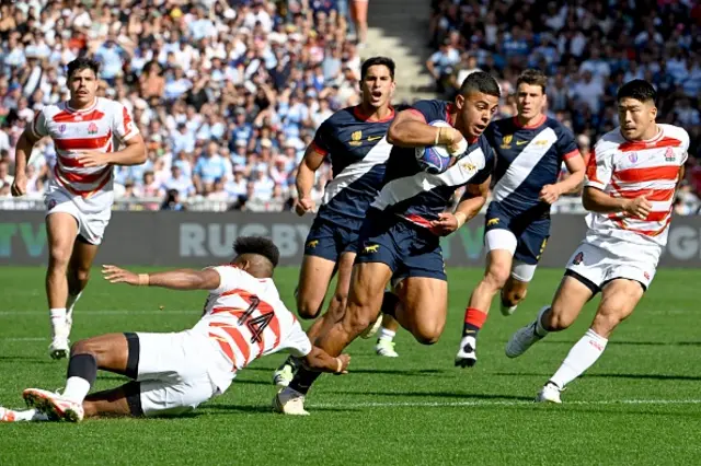 Argentina's inside centre Santiago Chocobares runs with the ball