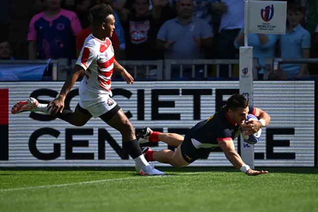 Argentina's left wing Mateo Carreras dives to score a try