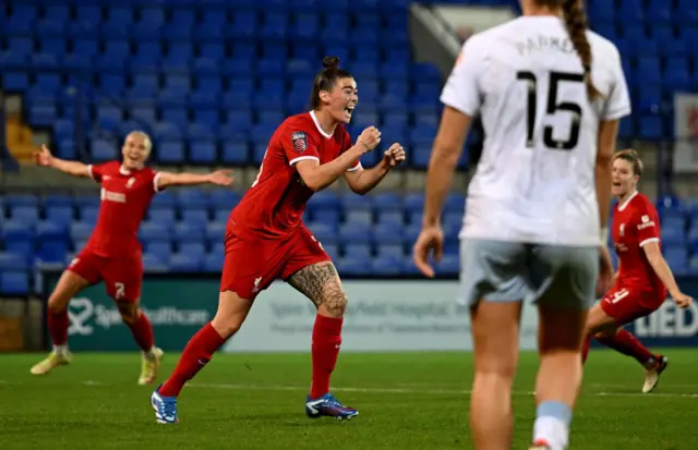 Natasha Flint celebrates her goal v Villa as the defence stand stunned.