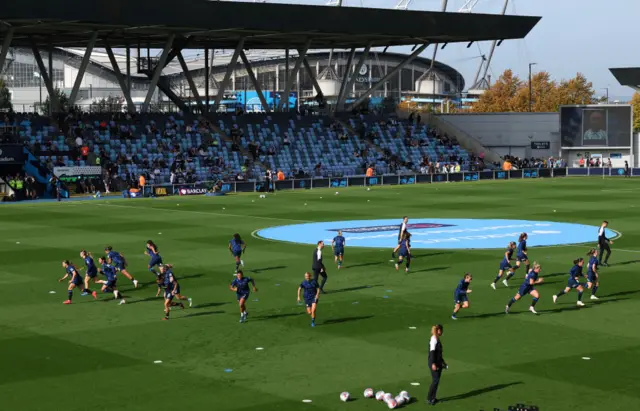 Chelsea players warm up at the Academy stadium.