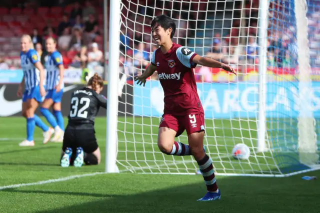 Ueki celebrates scoring her goal and west ham's second of the game.