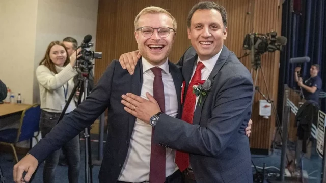 Michael Shanks celebrates with Scottish Labour leader Anas Sarwar