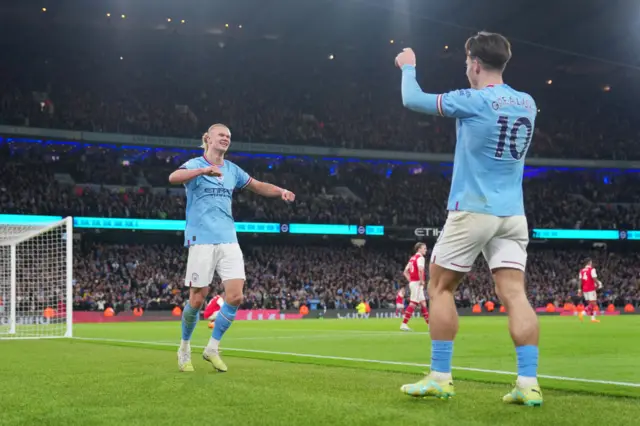 Erling Haaland and Jack Grealish celebrate at the Emirates