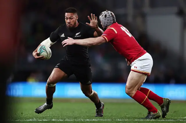 George Moala fends against Jonathan Davies of Wales while playing for New Zealand during a match in 2017