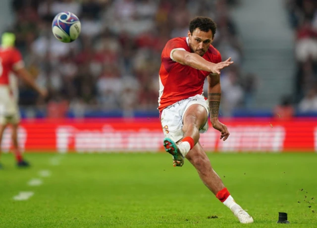William Havili kicks the ball off the tee
