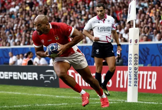 Tonga's left wing Afusipa Taumoepeau runs to score