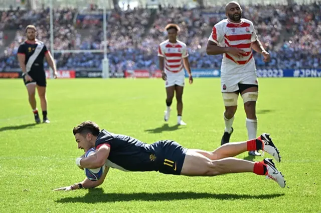 Argentina's left wing Mateo Carreras dives to score a try