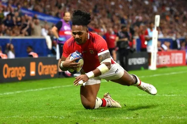 Solomone Kata of Tonga dives in the corner to score a try