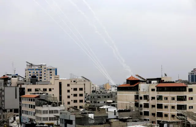 A picture taken from Gaza shows rockets fired towards Israel