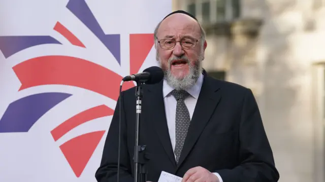 Chief Rabbi Sir Ephraim Mirvis speaking at a vigil outside Downing Street in London.