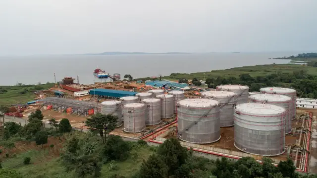 An aerial view of a new fuel storage complex on January 15, 2022 in Entebbe, Uganda on January 15, 2022 in Entebbe, Uganda. The lakeside complex will play a key role in the region's oil infrastructure, increasing Uganda's oil storage capacity and reducing freight costs, as transportation of petroleum products is moved from roads to the lake.