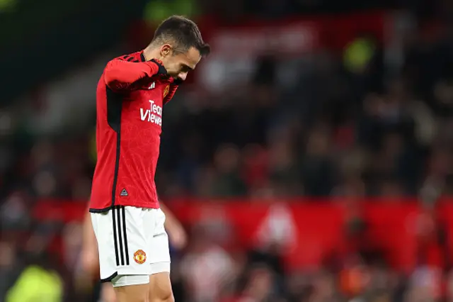 Reguilon bites his shirt as he walks off the pitch