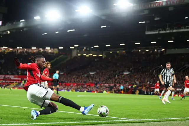 Aaron Wan-Bissaka slides to tee the ball in