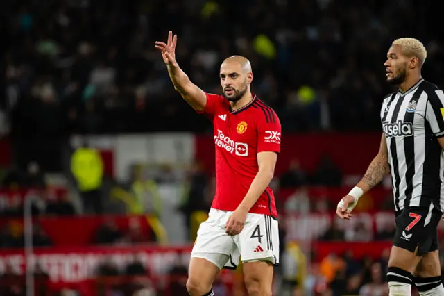 Sofyan Amrabat waves his arm