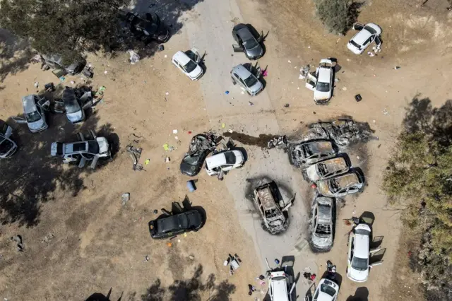 Abandoned and torched vehicles at the site of the October 7 attack on the Supernova desert music Festival