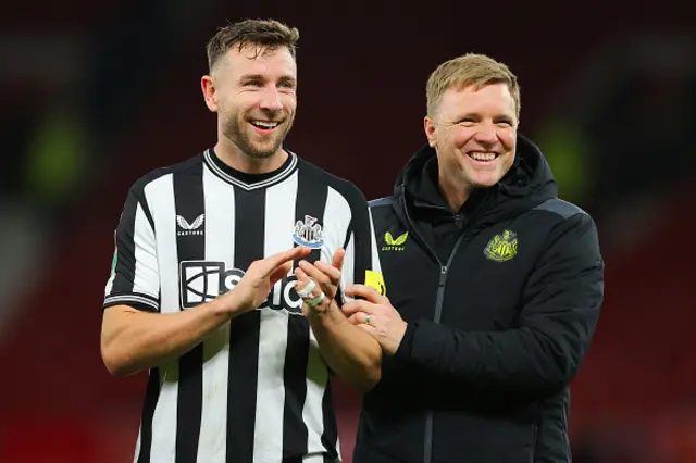 Paul Dummett of Newcastle United and Eddie Howe smile