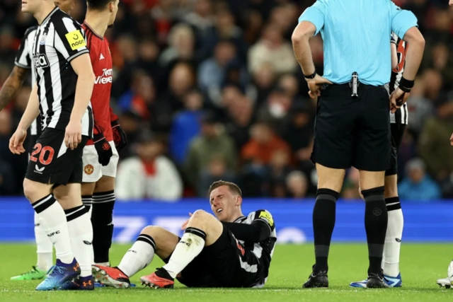 Matt Targett lays on the floor injured