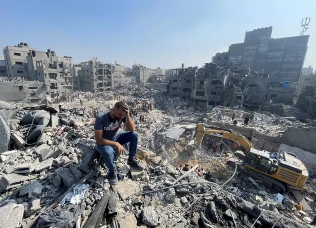 Man sitting among rubble in Jabalia camp