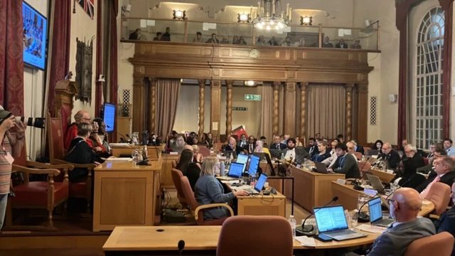 Council chamber full of councillors mid debate