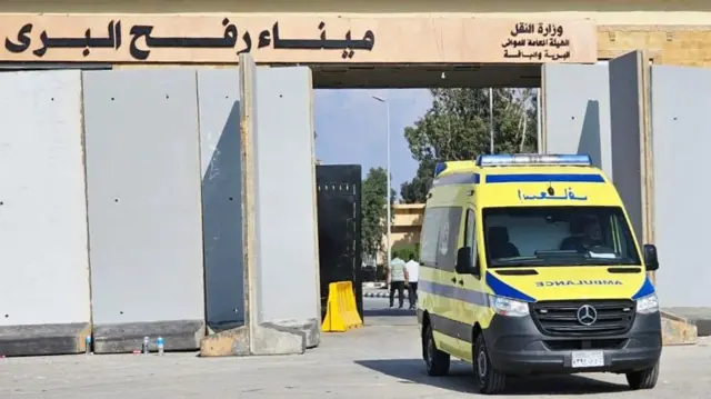 An ambulance heads into Egypt taking an injured person from Gaza to hospital