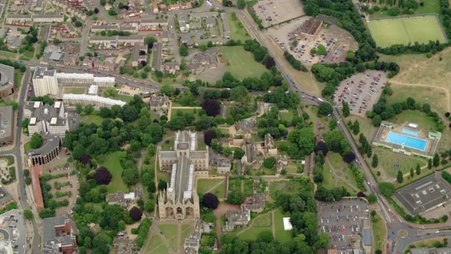 Aerial view of Peterborough Cathedral, Lido and athletics track